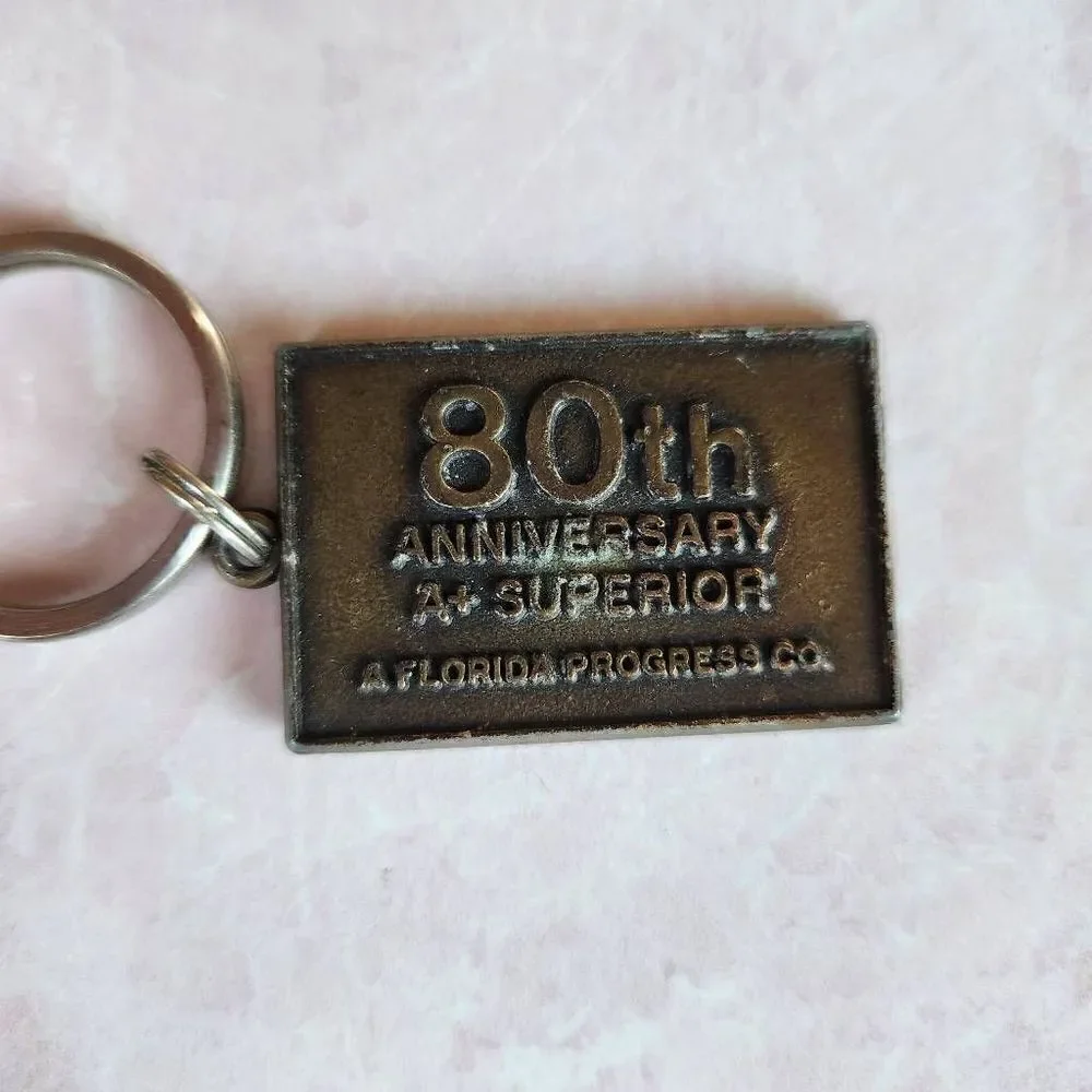 bronze vintage metal keychain plaque Florida Progress Co. 80th anniversary A+ su